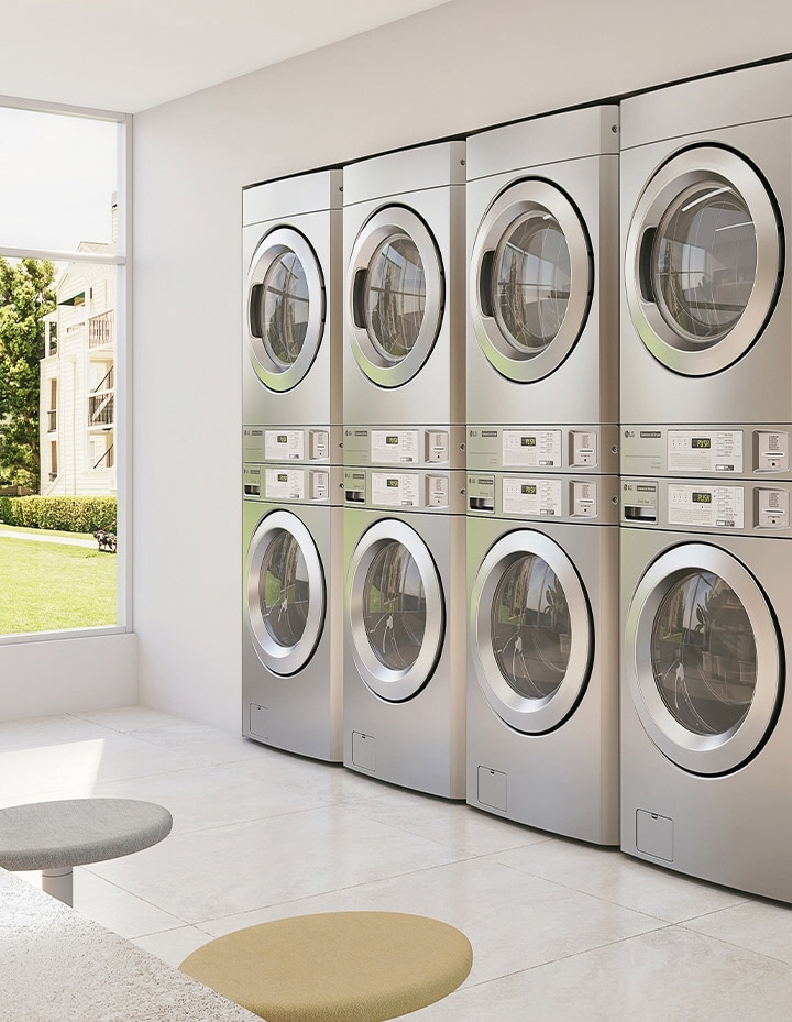 Commercial laundry room featuring stacked dryers and washers with user-friendly layout	