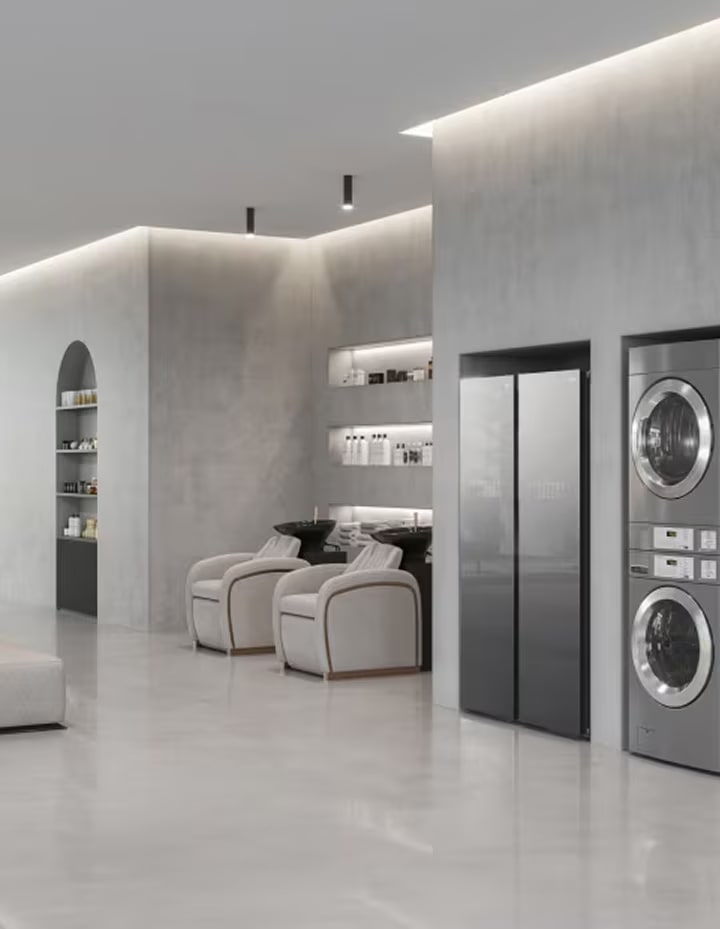 Modern spa interior featuring integrated commercial washer and dryer within a calm, minimalist space	
