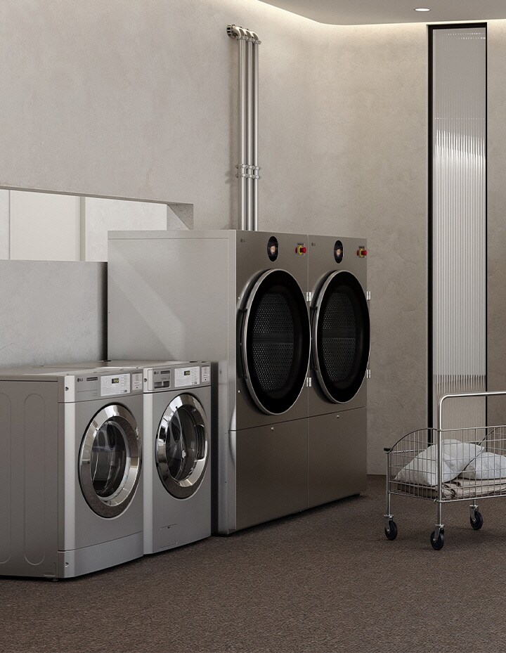 Hotel service laundry room equipped with commercial washers, dryers, carts, and linen storage	