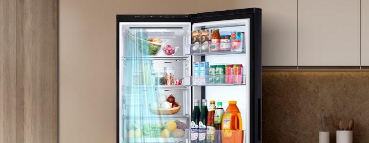 Open LG refrigerator in a modern kitchen showing organized food storage to explain how refrigeration keeps food fresh.	