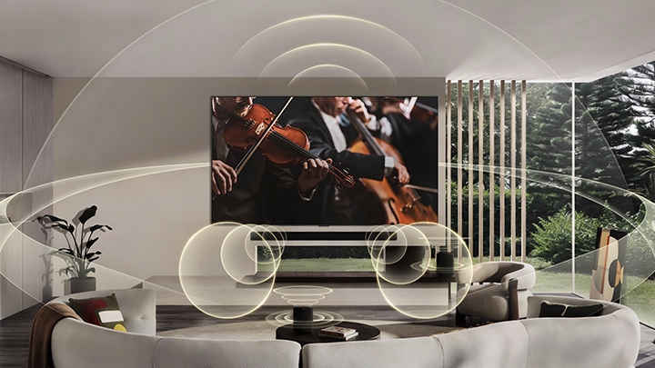 LG OLED evo AI G6 with WOW Orchestra and WOWCAST displays a concert scene with a soundbar below the screen, while graphic sound waves extend across the living room to convey synchronized, wireless surround sound.