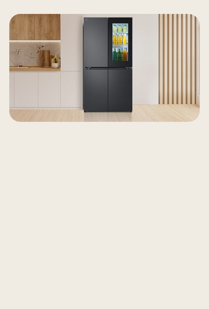 Black LG Multi-Door fridge freezer with InstaView Door-in-Door placed in a beige-toned kitchen. The fridge has a spacious design with visible storage sections.