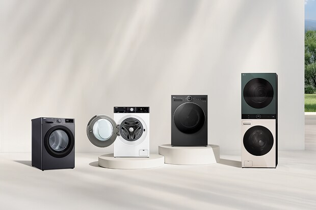 LG washer and dryer lineup in front of a beige wall. Includes a tumble dryer, front load washer with open door, washer dryer combo, and WashTower. A forest view is visible on the right.	