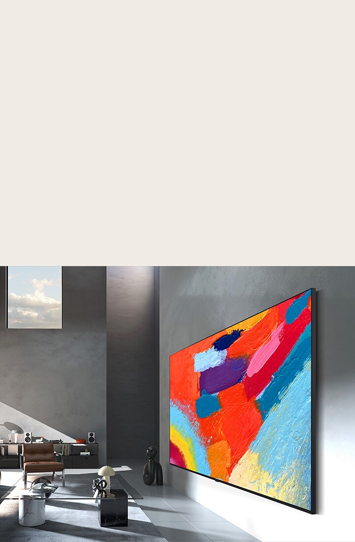 LG Micro RGB evo AI MRGB95, designed with Flush-fit Design, is seamlessly wall-mounted in a spacious room, displaying bold artwork in vivid colors that harmonize with the surrounding interior. 	