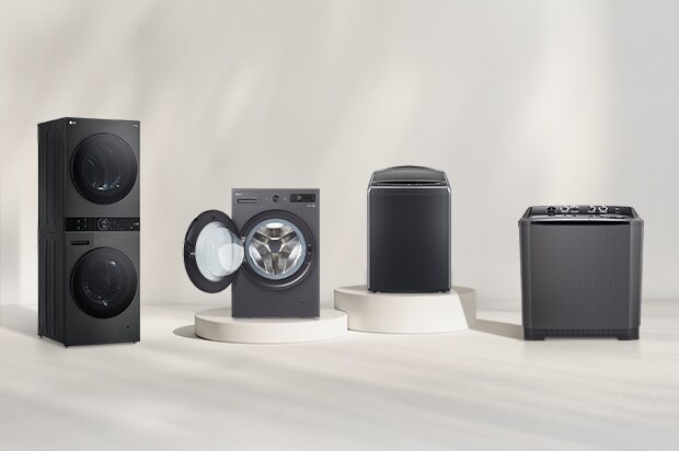 LG washer and dryer lineup in front of a beige wall. Includes a tumble dryer, front load washer with open door, washer dryer combo, and WashTower. A forest view is visible on the right.