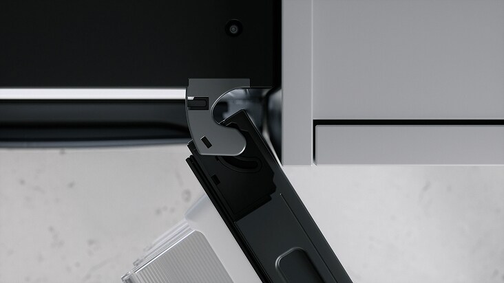 Close-up view of LG refrigerator hinge mechanism showing precise door alignment and smooth opening design.	