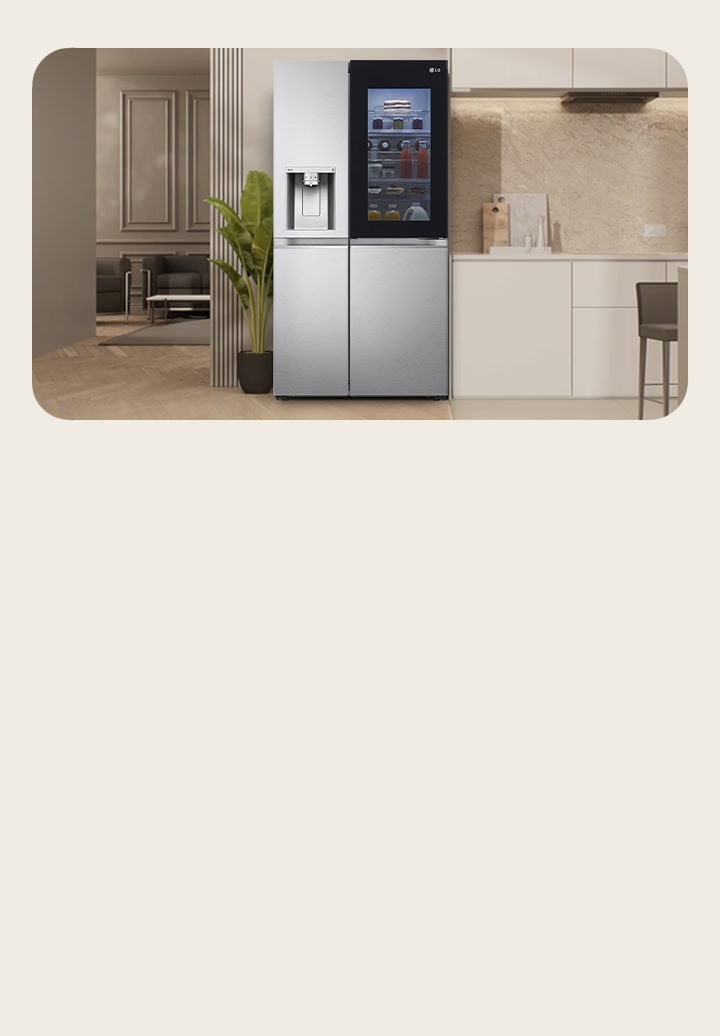LG silver side-by-side freezer with water purifier in the center. You can see a large living room on the left and a modern kitchen on the right.