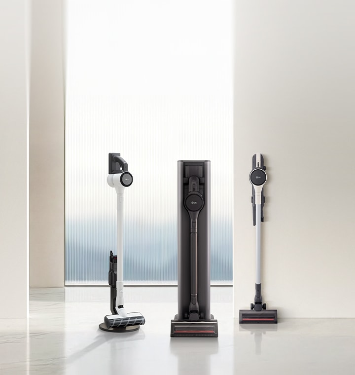 LG vacuum cleaner lineup including handstick and all-in-one tower models displayed in a modern interior setting.