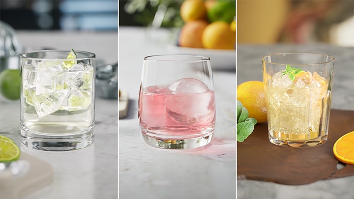 Ice made by the refrigerator is dispensed through the dispenser into cups, with each glass containing a different ice shape.