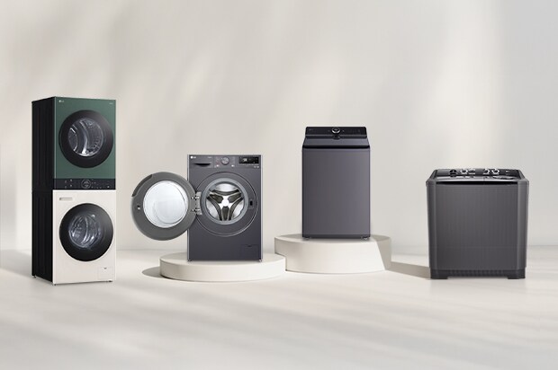 LG washer and dryer lineup in front of a beige wall. Includes a tumble dryer, front load washer with open door, washer dryer combo, and WashTower. A forest view is visible on the right.