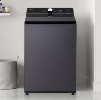 A top-loading washing machine is located in a multi-purpose room with a modern interior on the white floor