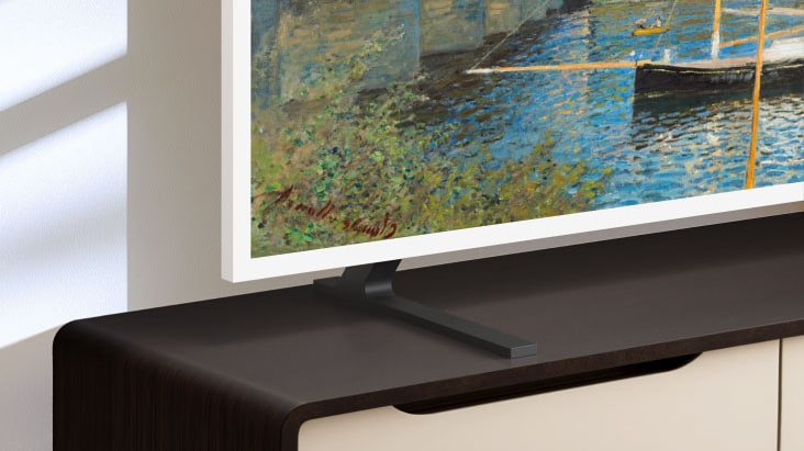LG Gallery TV AI with frame LX7 ART TV and Height Adjustable Stand is placed on a media console as the stand moves up and down, allowing flexible screen positioning to fit different room layouts and viewing preferences.