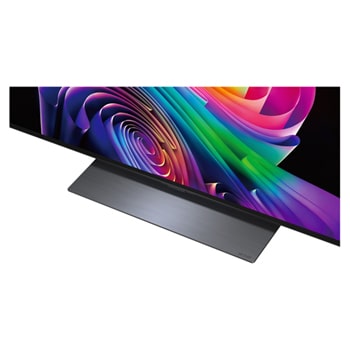 LG OLED evo AI C6 is wall-mounted in a styled living space, featuring an ultra-slim design with narrow bezels, and it displays a riverside cityscape at sunset on screen.