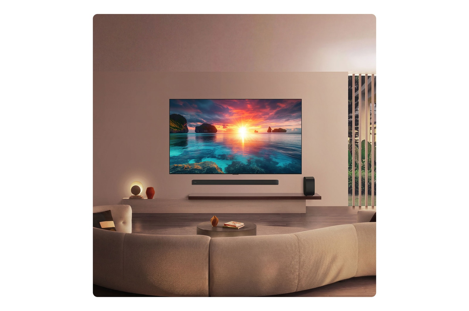 LG OLED evo AI G6 displays a vivid ocean sunset scene, with a soundbar and speaker positioned below the screen, enhancing a calm and atmospheric living space.