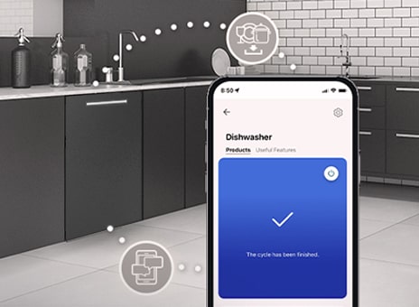 Smartphone displaying LG ThinQ app for controlling dishwasher cycles in a modern kitchen.