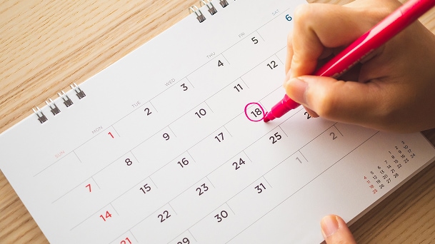 A person marking the calendar to emphasize routine care for long-lasting performance