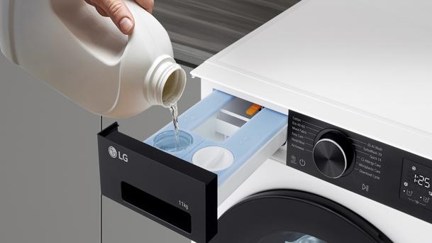 LG front load washing machine with a person pouring liquid detergent into the dispenser highlighting proper detergent use