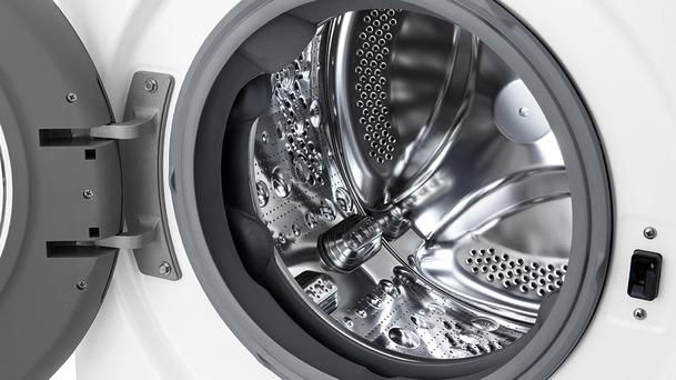 LG front load washing machine with an empty drum and the door open