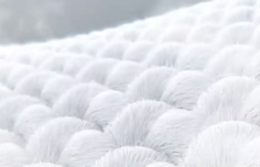 LG washing machine steam function close up visualization of steam gently penetrating and softening fabric fibers