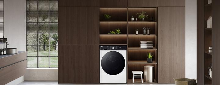 lg front load washing machine built into modern wooden cabinet shelves in a stylish kitchen interior