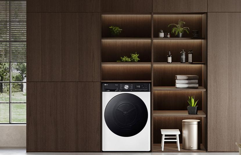 lg front load washing machine built into modern wooden cabinet shelves in a stylish kitchen interior