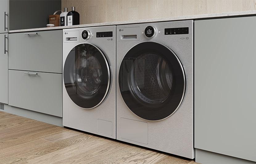LG washing machine and dryer installed side-by-side in a built-in cabinet setup, shown in a modern laundry room.	