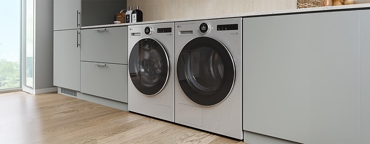 LG washing machine and dryer installed side-by-side in a built-in cabinet setup, shown in a modern laundry room.