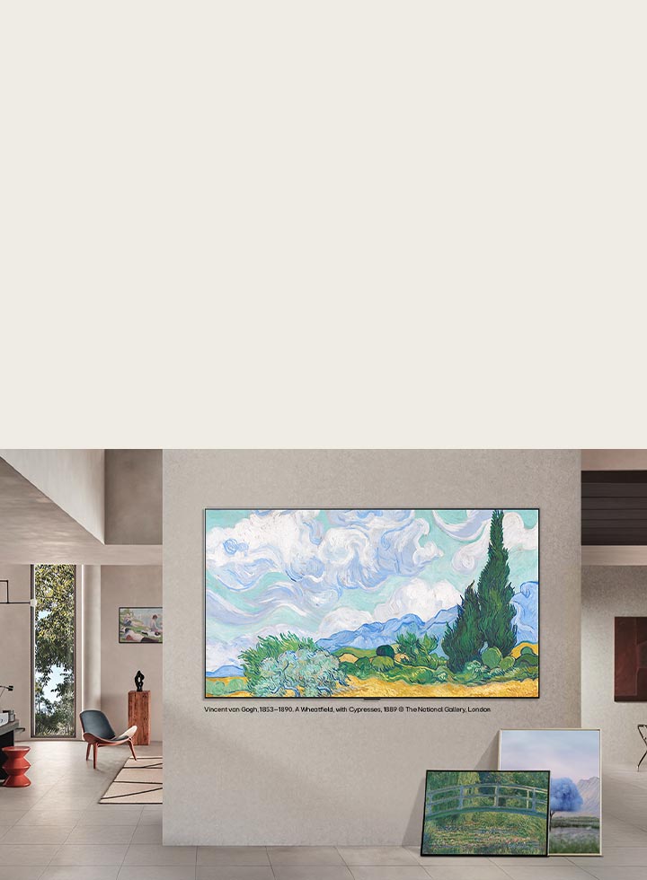 LG QNED evo AI QNED83 Mini LED with LG Gallery+ Diverse Art Content displays artworks on a wall-mounted screen in a gallery-style living space, accompanied by a canvas and additional framed art nearby.