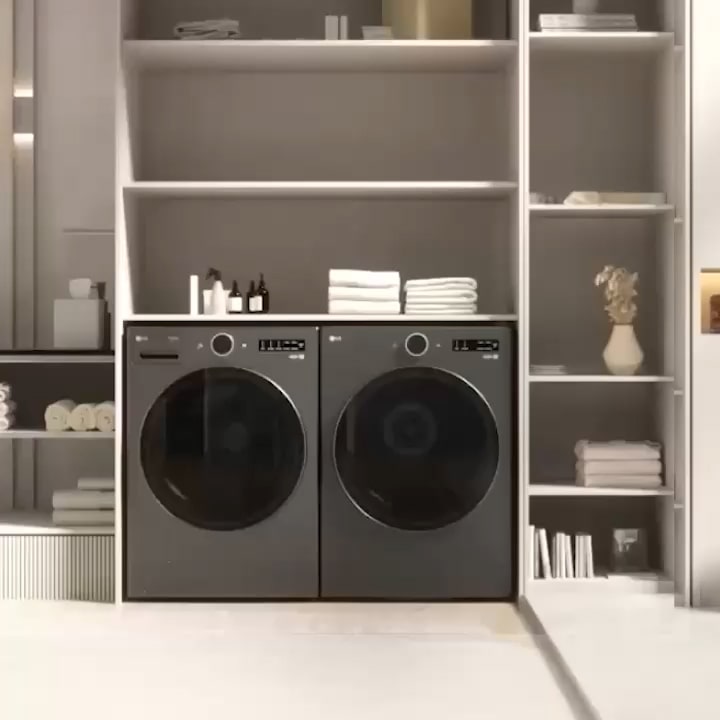 LG WashTower™ in a modern closet beside an ironing board showing its slim vertical design and easy center control panel.