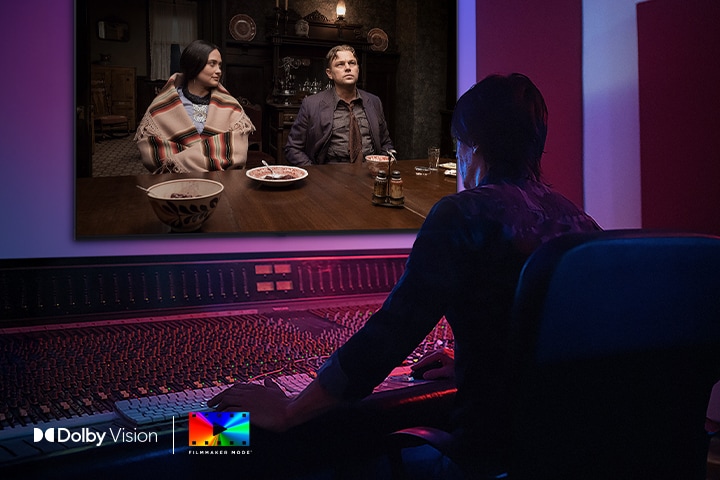 LG QNED evo AI Mini LED is shown in a studio as a director works at a control panel while editing a movie displayed on screen. The Dolby Vision and FILMMAKER MODE logos appear at the upper left.