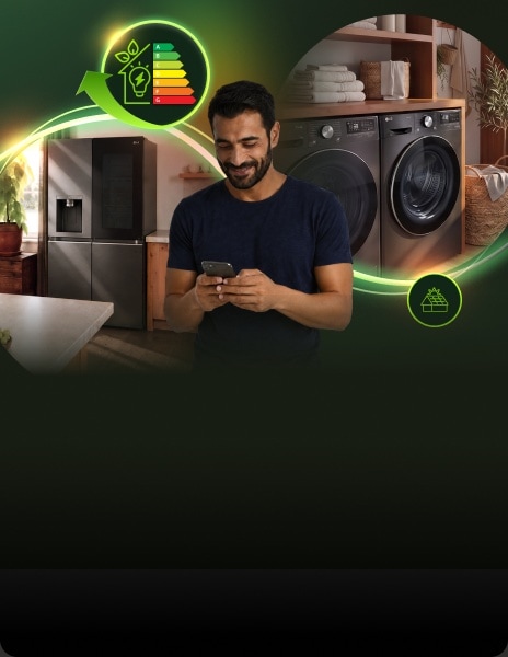 Ein Mann nutzt ein Smartphone in einem modernen Waschraum mit LG Waschmaschine, Trockner und Kühlschrank, umgeben von leuchtenden Energieeffizienz-Grafiken.
