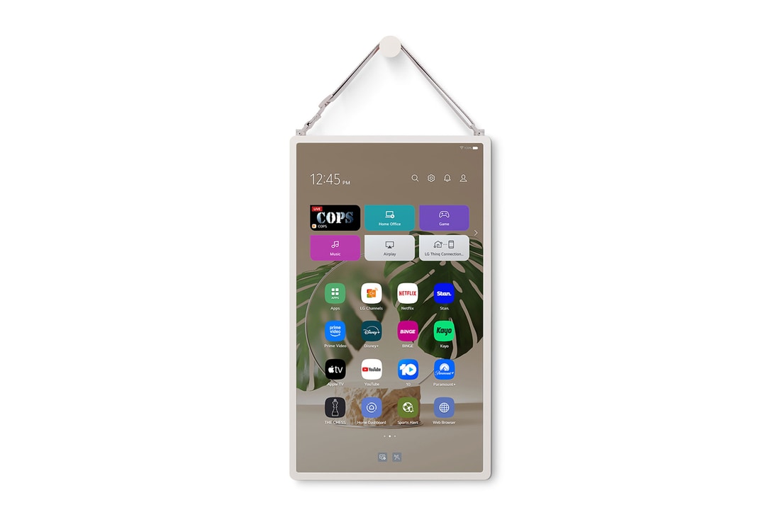 LG StanbyME 2 is hung on the wall using the wall strap.