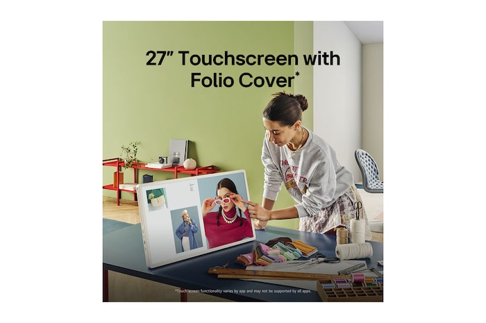 A person rolling their LG StanbyME 2 using the TV stand. The text explains how the Super Portable Screen has 4 hours of wireless playback and USB-C.