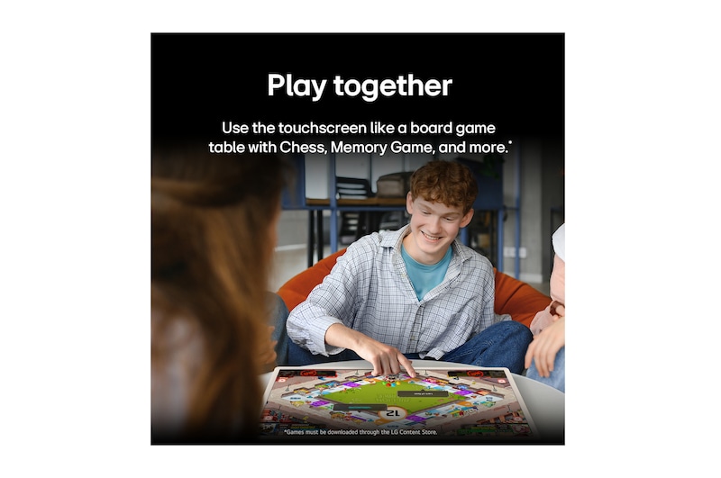 A group of friends playing a board game on the LG StanbyME 2 on the table. The Big Tablet Screen is featured. Text talks about playing directly on the touchscreen.