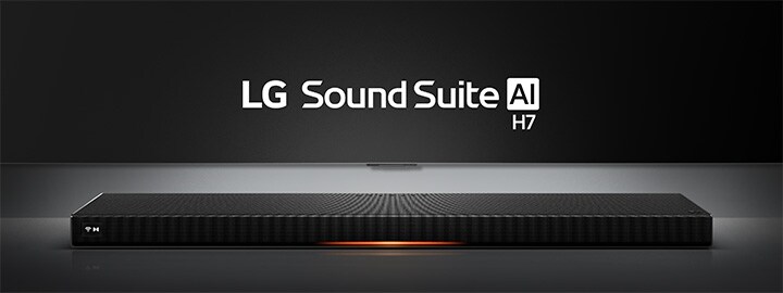 LG Sound Suite H7 soundbar with a slim, sleek black design displayed on a surface under a spotlight
