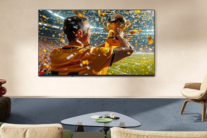 LG NANO 4K UHD AI NU85 Ultra Big TV is wall-mounted in a living space, displaying a large-scale sports victory scene with confetti and a raised trophy, emphasizing vivid color, clarity, and immersive scale.