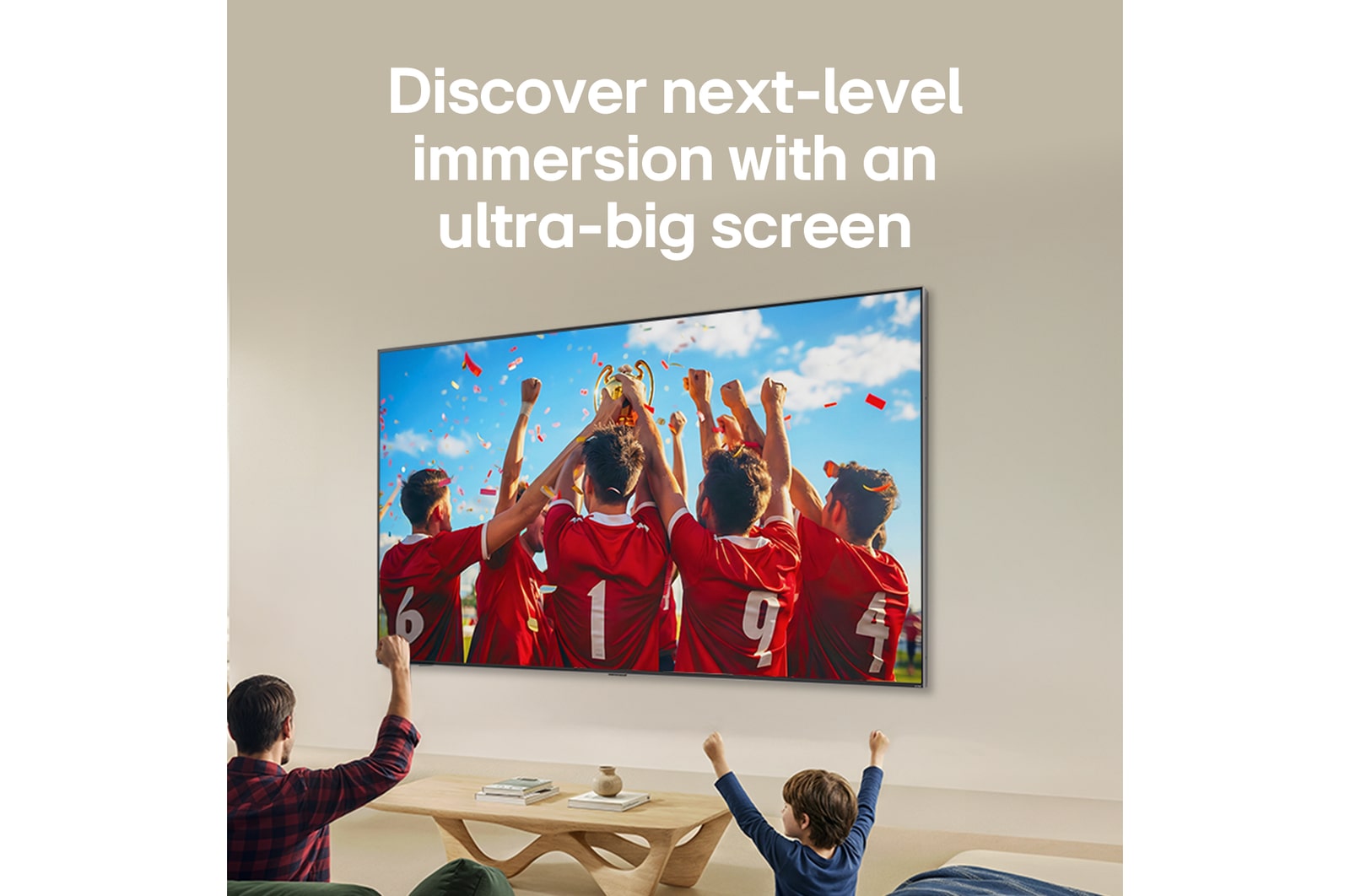 LG QNED evo AI QNED85 Ultra Big TV is wall-mounted in a living room, displaying a sports victory celebration with vivid colors and refined picture quality across the wide screen as a family cheers together.