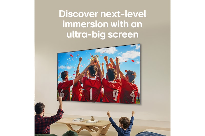 LG QNED evo AI QNED85 Ultra Big TV is wall-mounted in a living room, displaying a sports victory celebration with vivid colors and refined picture quality across the wide screen as a family cheers together.