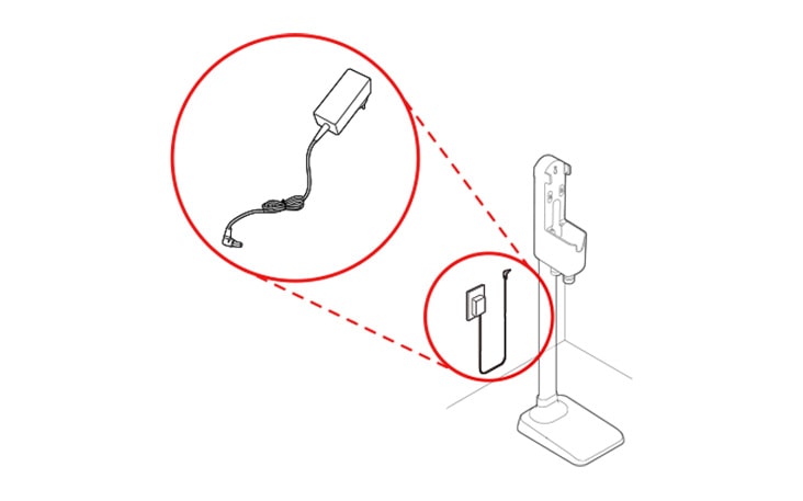 The adapter is plugged behind the charging station