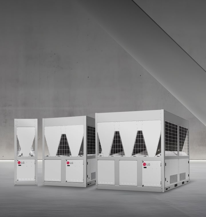 Three LG inverter scroll chillers are displayed in a space with minimalist concrete walls and soft lighting. 	