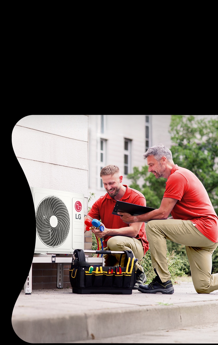 LG Air to Water Heat Pump THERMA V R290 Monobloc, black-colored outdoor unit is placed on the exterior green wall of the house.