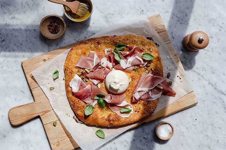 Spicy Burrata And Prosciutto Pizza With Pistachios