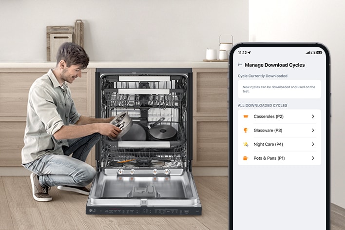 A man is holding a pot next to a dishwasher while a smartphone displays a pots cycle on the ThinQ® app. 