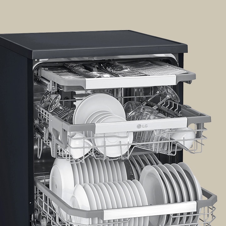 Showcasing how spatulas, spoons, forks, and knives are arranged in the 3rd rack of an LG free-standing dishwasher.