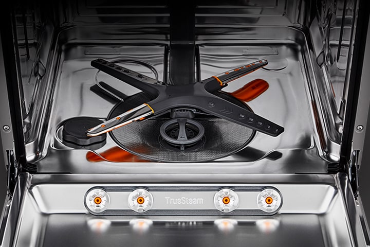 The stainless steel interior of the dishwasher.	