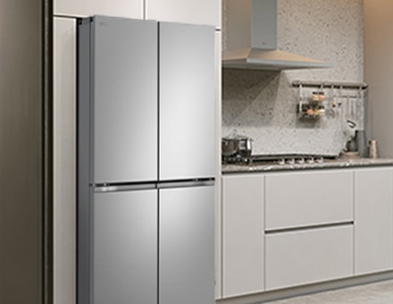 Modern kitchen interior with stainless fridge.