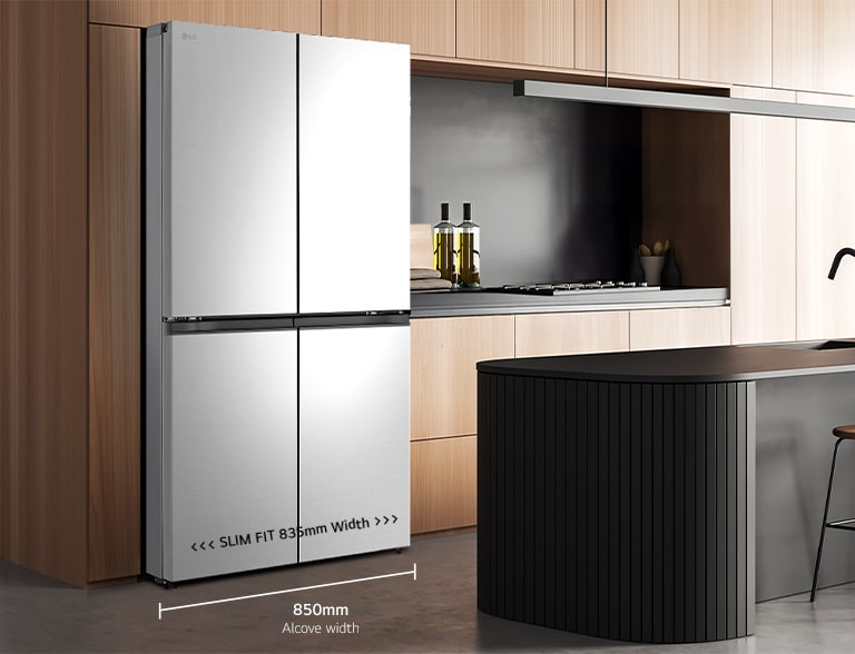Modern kitchen interior with stainless fridge.