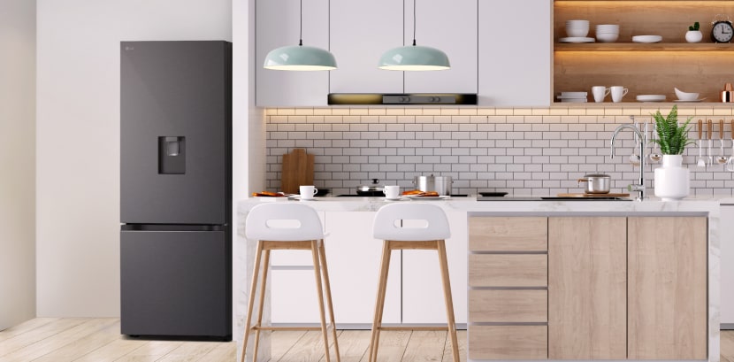 The overall view of  lg bottom freezer refrigerator with water dispenser in a kitchen.