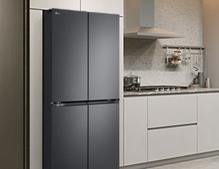Modern kitchen interior with stainless fridge.