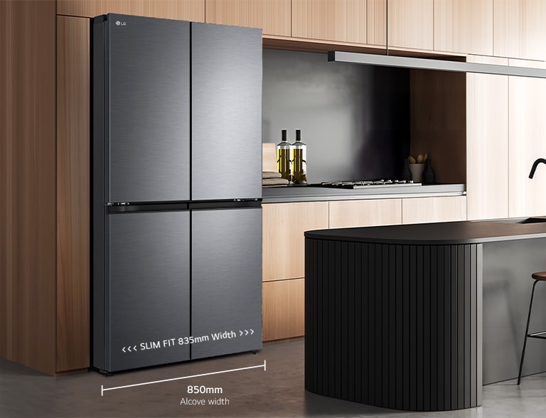 Modern kitchen interior with stainless fridge.